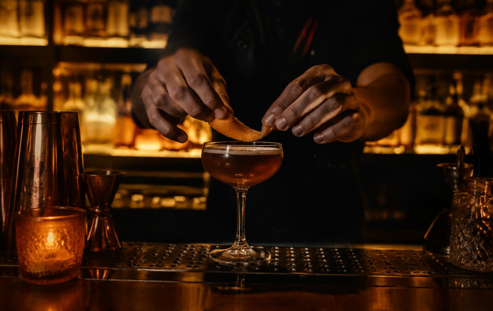 Bartender garnishing a cocktail